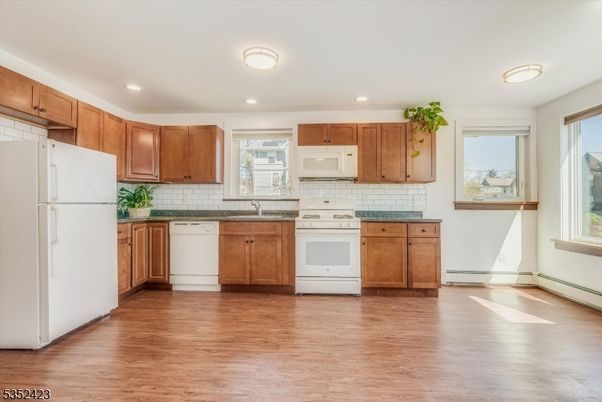 Interior, Kitchen, Recessed Lighting, Tile Countertops, Wood Texture Flooring