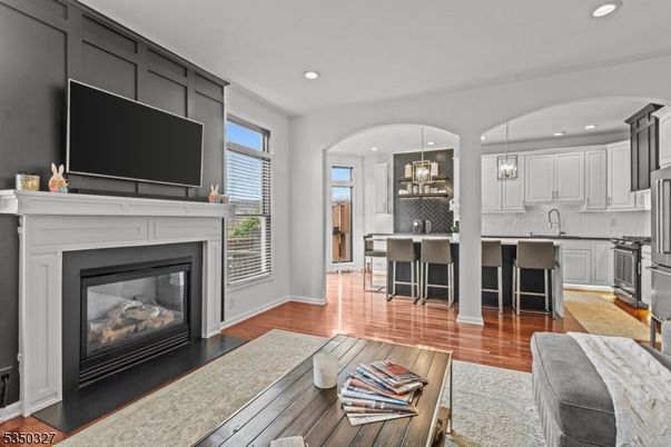 Fireplace, Interior, Kitchen, Pendant Lights, Recessed Lighting, Stainless Steel Appliances, Wood Texture Flooring