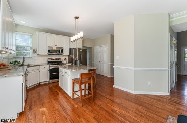 Chandelier, Interior, Kitchen, Pendant Lights, Recessed Lighting, Stainless Steel Appliances, Wood Texture Flooring