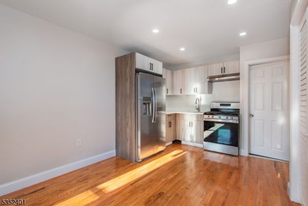 Interior, Kitchen, Recessed Lighting, Stainless Steel Appliances, Wood Texture Flooring