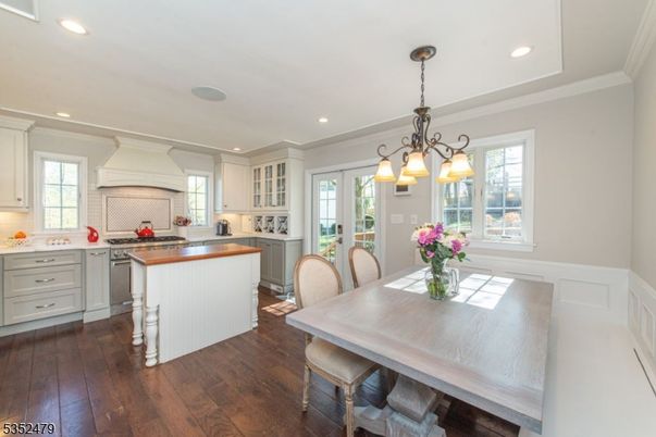 Chandelier, Dining room, Interior, Kitchen, Recessed Lighting, Stainless Steel Appliances, Wood Texture Flooring