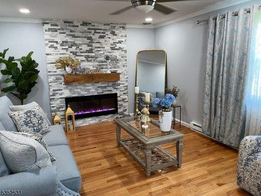 Fireplace, Interior, Living room, Recessed Lighting, Stone Walls, Wood Texture Flooring