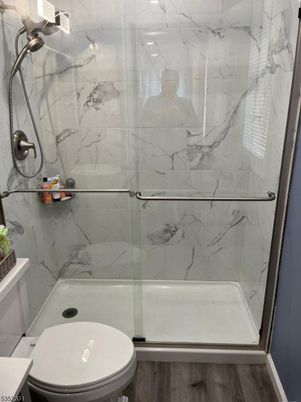 Bathroom, Glass Shower, Interior, Marble Walls, Wood Texture Flooring