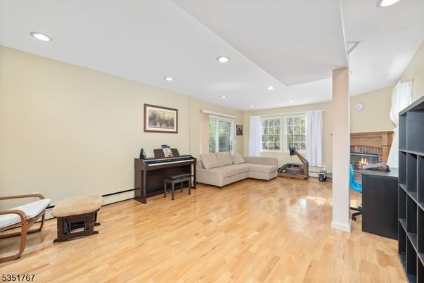 Fireplace, Interior, Living room, Piano, Recessed Lighting, Wood Texture Flooring