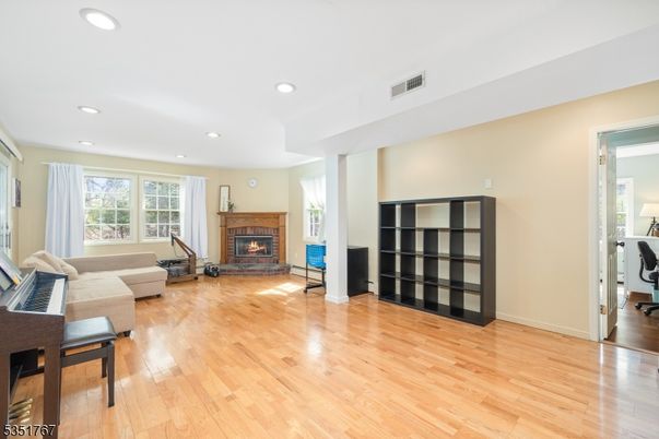 Fireplace, Interior, Living room, Recessed Lighting, Wood Texture Flooring