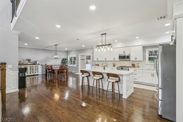 Dining room, Interior, Kitchen, Pendant Lights, Recessed Lighting, Stainless Steel Appliances, Wood Texture Flooring