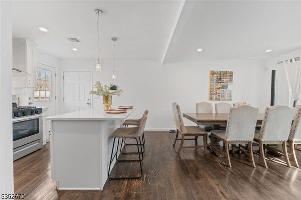 Dining room, Interior, Kitchen, Pendant Lights, Recessed Lighting, Stainless Steel Appliances, Wood Texture Flooring