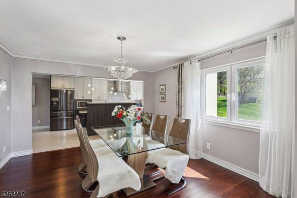 Chandelier, Dining room, Interior, Kitchen, Stainless Steel Appliances, Wood Texture Flooring