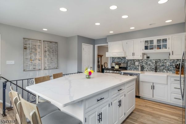 Dining room, Interior, Kitchen, Recessed Lighting, Stainless Steel Appliances, Wood Texture Flooring