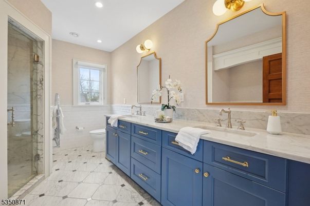 Bathroom, Dual Sink Vanities, Glass Shower, Interior, Marble Walls, Recessed Lighting