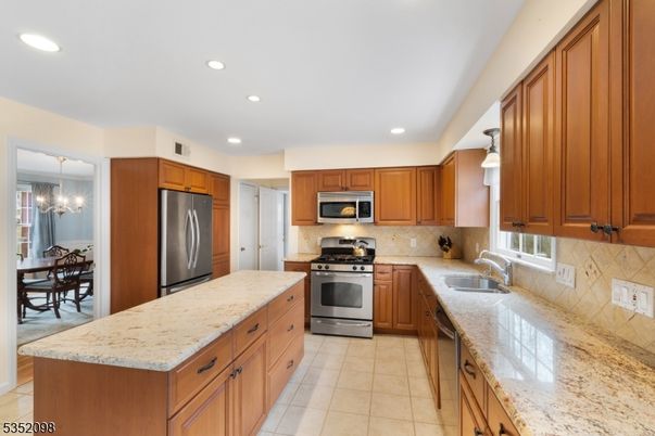Chandelier, Dining room, Interior, Kitchen, Pendant Lights, Recessed Lighting, Stainless Steel Appliances