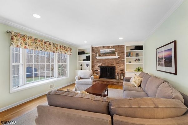 Fireplace, Interior, Living room, Recessed Lighting, Stone Walls, Wood Texture Flooring