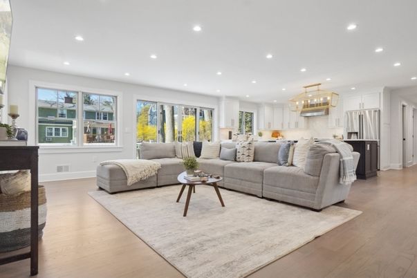 Chandelier, Fireplace, Interior, Kitchen, Living room, Pendant Lights, Recessed Lighting, Stainless Steel Appliances, Wood Texture Flooring