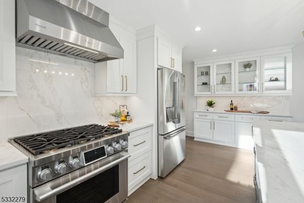 Interior, Kitchen, Marble Walls, Recessed Lighting, Stainless Steel Appliances, Wood Texture Flooring