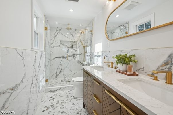 Bathroom, Dual Sink Vanities, Glass Shower, Interior, Marble, Marble Walls, Recessed Lighting