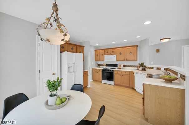 Dining room, Interior, Kitchen, Pendant Lights, Recessed Lighting, Stainless Steel Appliances, Wood Texture Flooring
