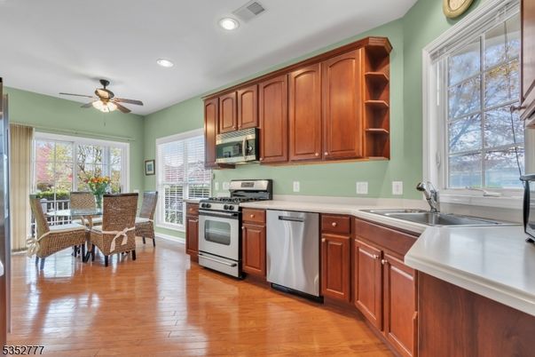 Dining room, Interior, Kitchen, Recessed Lighting, Stainless Steel Appliances, Wood Texture Flooring