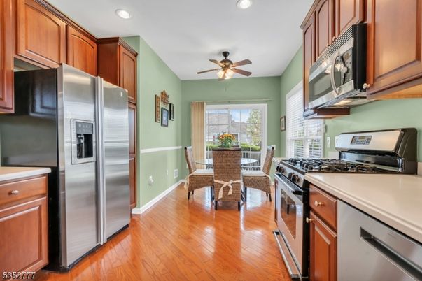 Dining room, Interior, Kitchen, Recessed Lighting, Stainless Steel Appliances, Wood Texture Flooring
