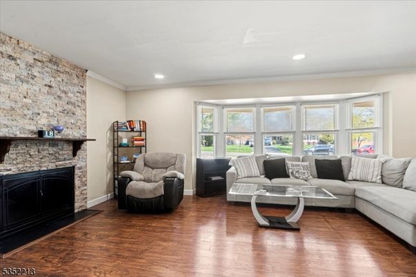 Fireplace, Interior, Living room, Recessed Lighting, Stone Walls, Wood Texture Flooring