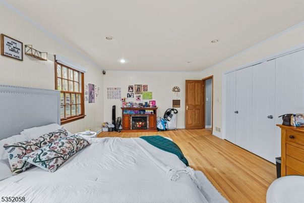 Bedroom, Fireplace, Interior, Recessed Lighting, Wood Texture Flooring