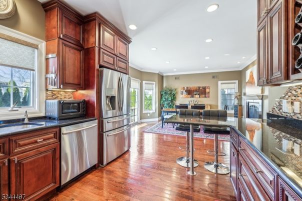 Dining room, Interior, Kitchen, Recessed Lighting, Stainless Steel Appliances, Wood Texture Flooring