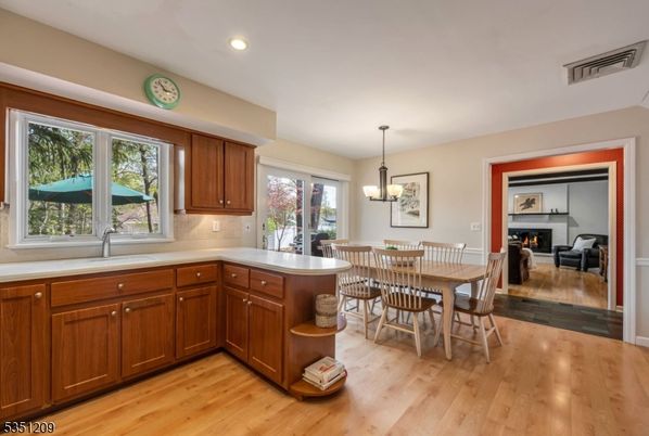 Dining room, Fireplace, Interior, Pendant Lights, Recessed Lighting, Wood Texture Flooring