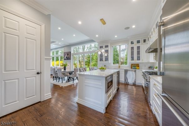 Dining room, Interior, Kitchen, Pendant Lights, Recessed Lighting, Stainless Steel Appliances, Wood Texture Flooring