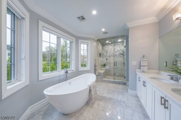 Bathroom, Dual Sink Vanities, Free Standing Baths, Glass Shower, Interior, Marble, Marble Walls, Recessed Lighting