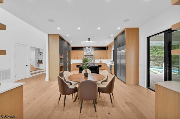 Dining room, Interior, Kitchen, Pendant Lights, Recessed Lighting, Stainless Steel Appliances, Wood Texture Flooring
