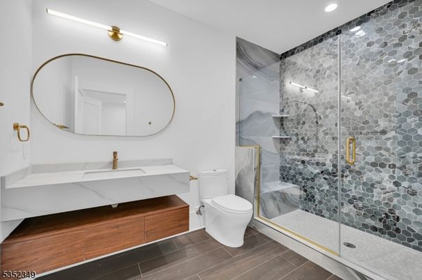 Bathroom, Glass Shower, Interior, Marble Walls, Recessed Lighting, Wood Texture Flooring