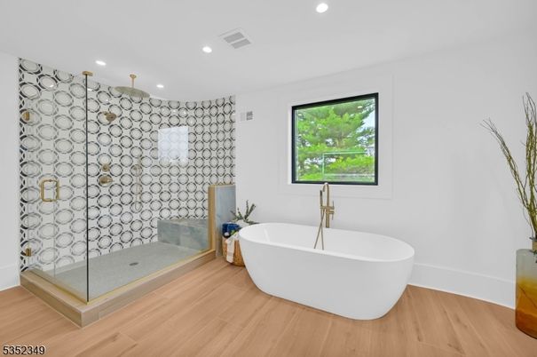 Bathroom, Free Standing Baths, Glass Shower, Interior, Recessed Lighting, Wood Texture Flooring