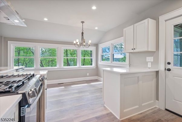 Chandelier, Interior, Kitchen, Recessed Lighting, Stainless Steel Appliances, Wood Texture Flooring