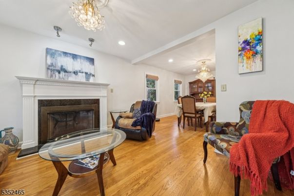 Chandelier, Dining room, Fireplace, Interior, Living room, Recessed Lighting, Wood Texture Flooring