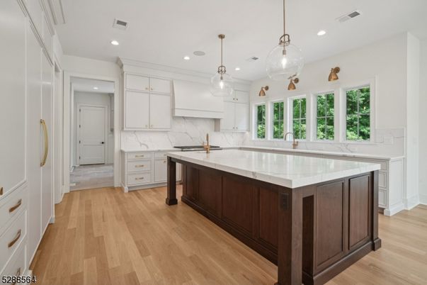 Interior, Kitchen, Marble Walls, Pendant Lights, Recessed Lighting, Wood Texture Flooring