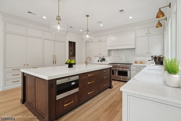Interior, Kitchen, Marble Walls, Pendant Lights, Recessed Lighting, Stainless Steel Appliances, Wood Texture Flooring