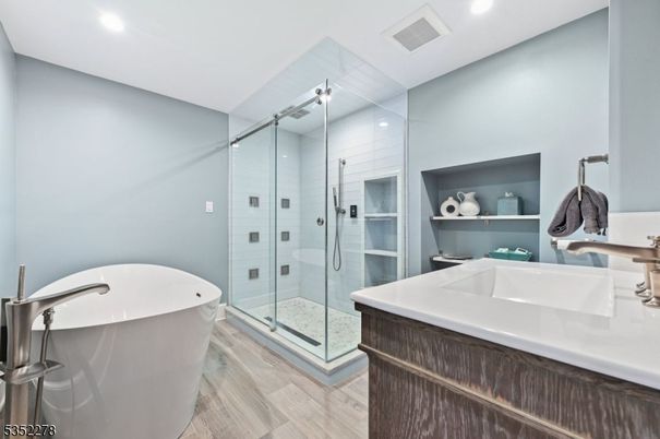 Bathroom, Free Standing Baths, Glass Shower, Interior, Recessed Lighting, Wood Texture Flooring