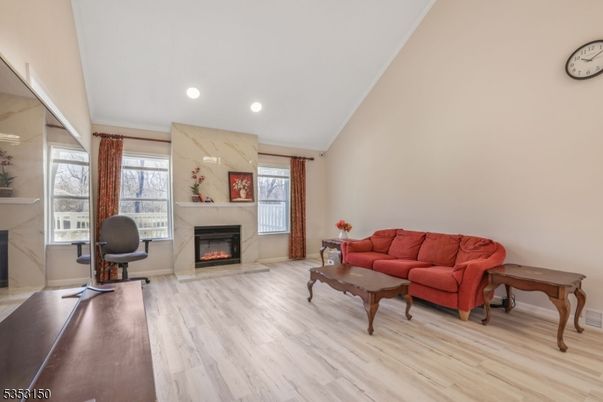 Fireplace, Interior, Living room, Marble Walls, Recessed Lighting, Wood Texture Flooring