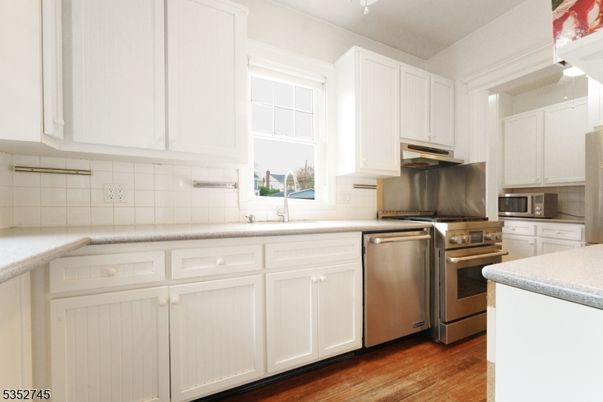 Interior, Kitchen, Stainless Steel Appliances, Tile Countertops, Wood Texture Flooring