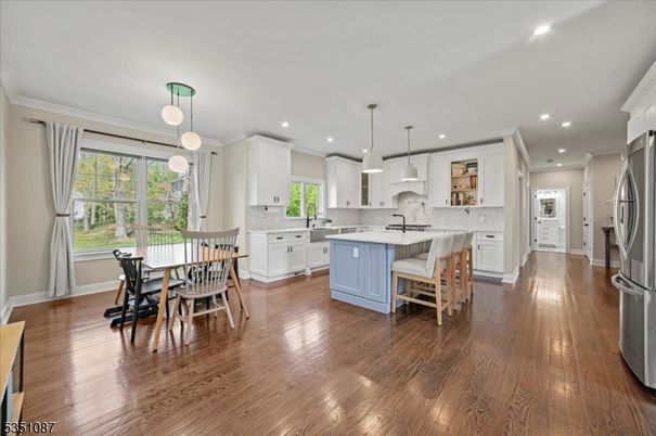 Dining room, Interior, Kitchen, Pendant Lights, Recessed Lighting, Stainless Steel Appliances, Wood Texture Flooring