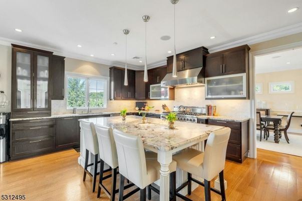 Dining room, Interior, Kitchen, Pendant Lights, Recessed Lighting, Stainless Steel Appliances, Wood Texture Flooring