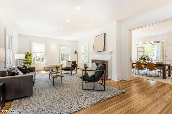 Dining room, Fireplace, Interior, Living room, Pendant Lights, Recessed Lighting, Wood Texture Flooring