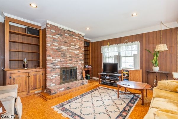 Fireplace, Interior, Living room, Pendant Lights, Recessed Lighting, Stone Walls, Wood Texture Flooring, Wooden Walls