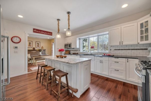 Dining room, Interior, Kitchen, Pendant Lights, Recessed Lighting, Stainless Steel Appliances, Wood Texture Flooring
