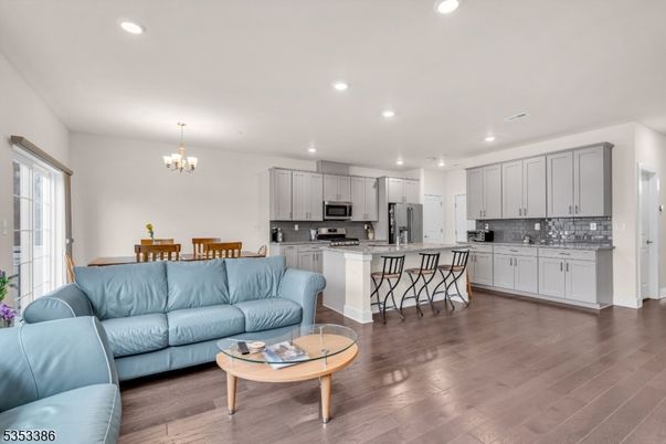 Chandelier, Dining room, Interior, Kitchen, Living room, Recessed Lighting, Stainless Steel Appliances, Wood Texture Flooring