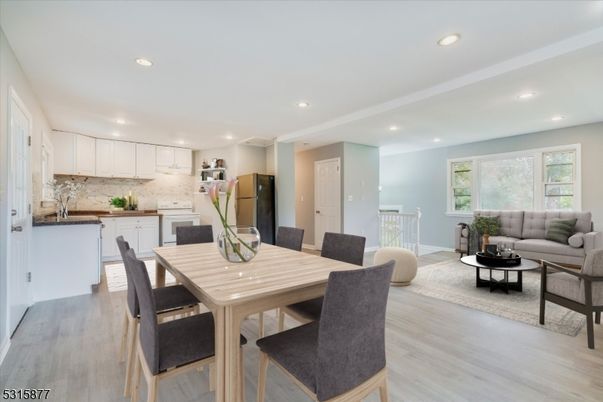 Dining room, Interior, Kitchen, Living room, Recessed Lighting, Stainless Steel Appliances, Wood Texture Flooring