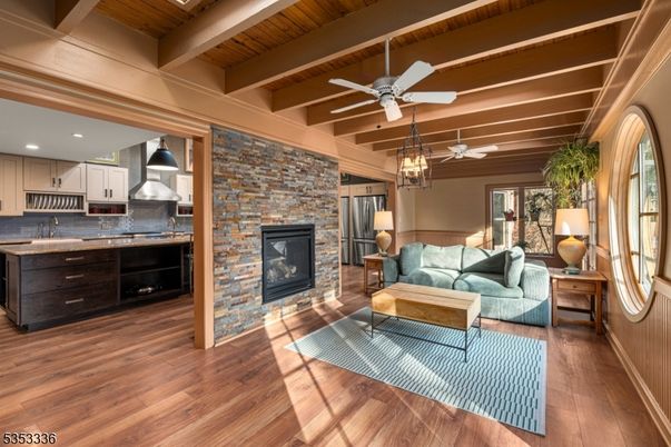 Fireplace, Interior, Kitchen, Living room, Pendant Lights, Recessed Lighting, Stainless Steel Appliances, Stone Walls, Wooden Beams, Wooden Ceilings, Wood Texture Flooring