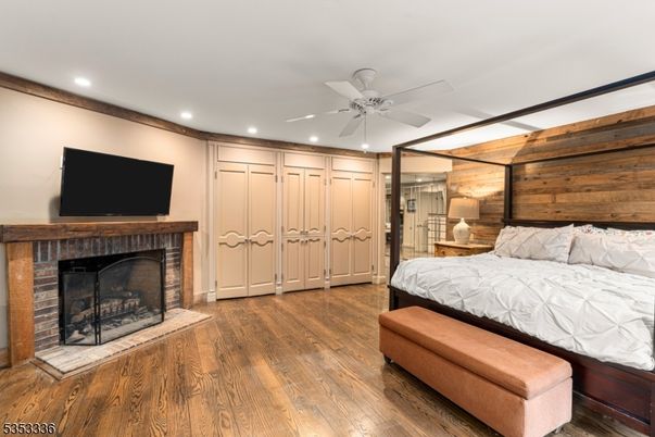 Bedroom, Fireplace, Interior, Recessed Lighting, Wood Texture Flooring