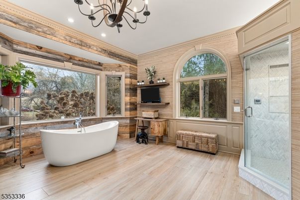 Bathroom, Chandelier, Free Standing Baths, Glass Shower, Interior, Recessed Lighting, Wood Texture Flooring, Wooden Walls