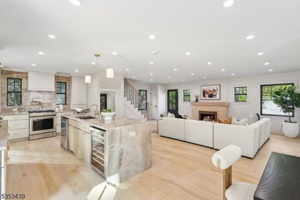 Fireplace, Interior, Kitchen, Living room, Pendant Lights, Recessed Lighting, Stainless Steel Appliances, Wood Texture Flooring