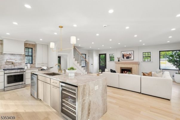 Fireplace, Interior, Kitchen, Living room, Pendant Lights, Recessed Lighting, Stainless Steel Appliances, Wood Texture Flooring